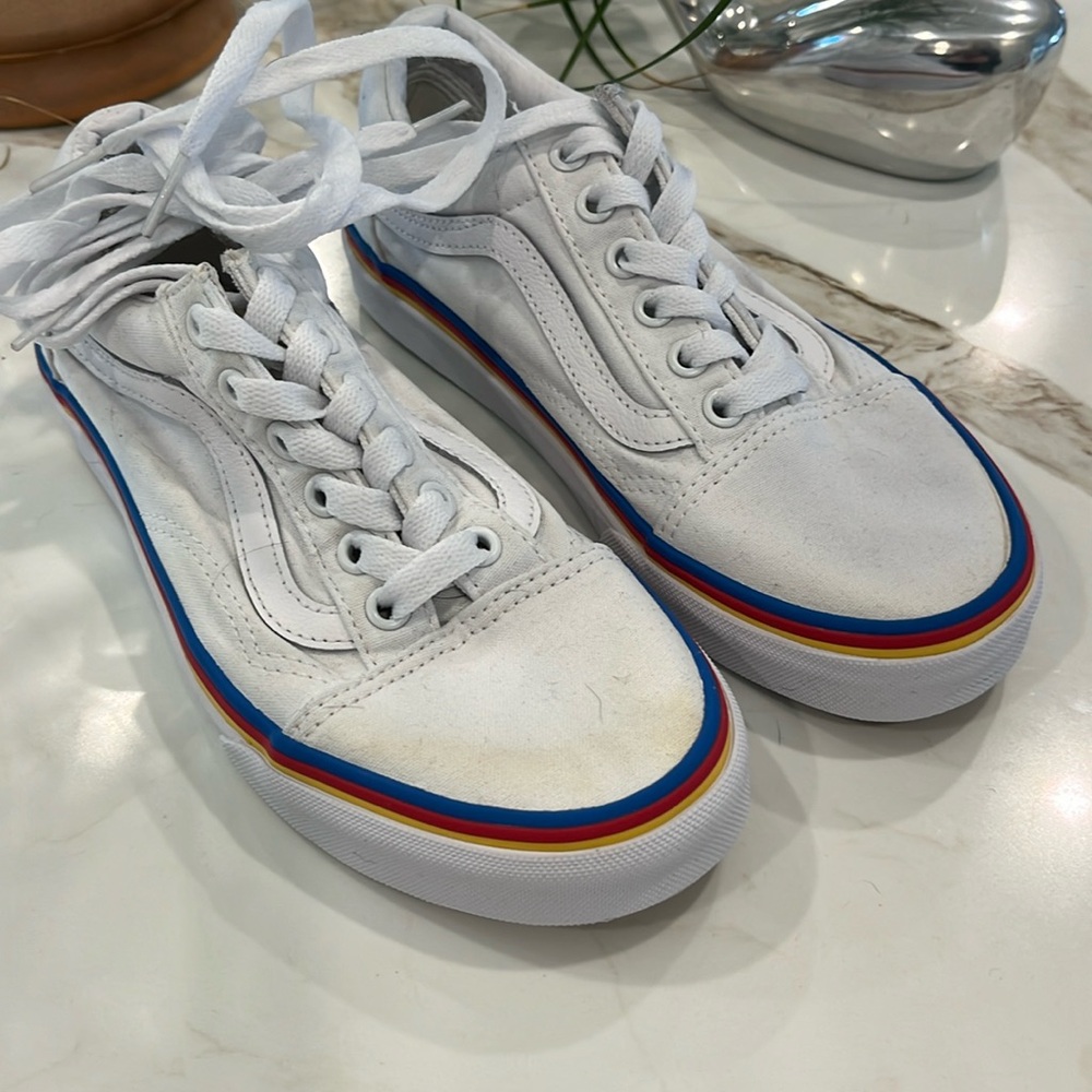 GUC white Vans with yellow red and blue stripe detail.